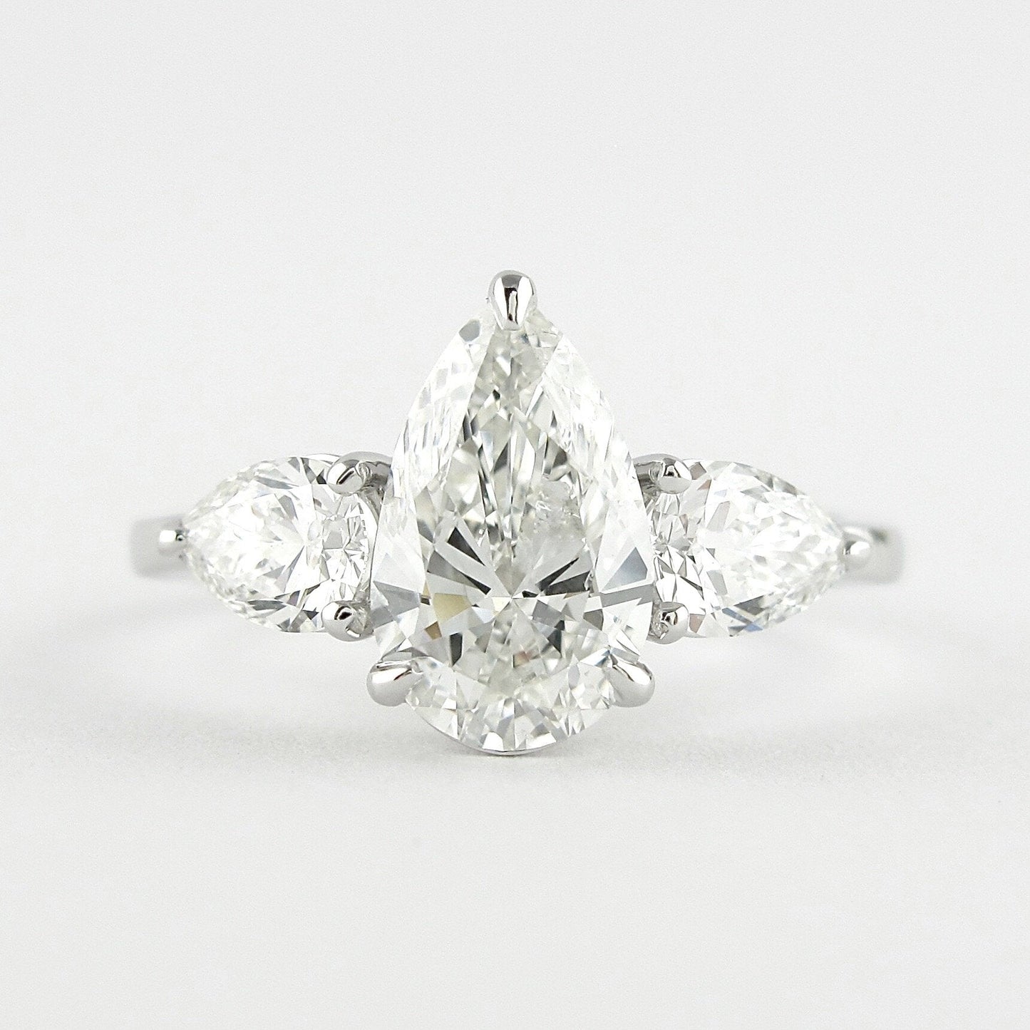 1.50 CT Pear Cut Three Stone Style Moissanite Engagement Ring