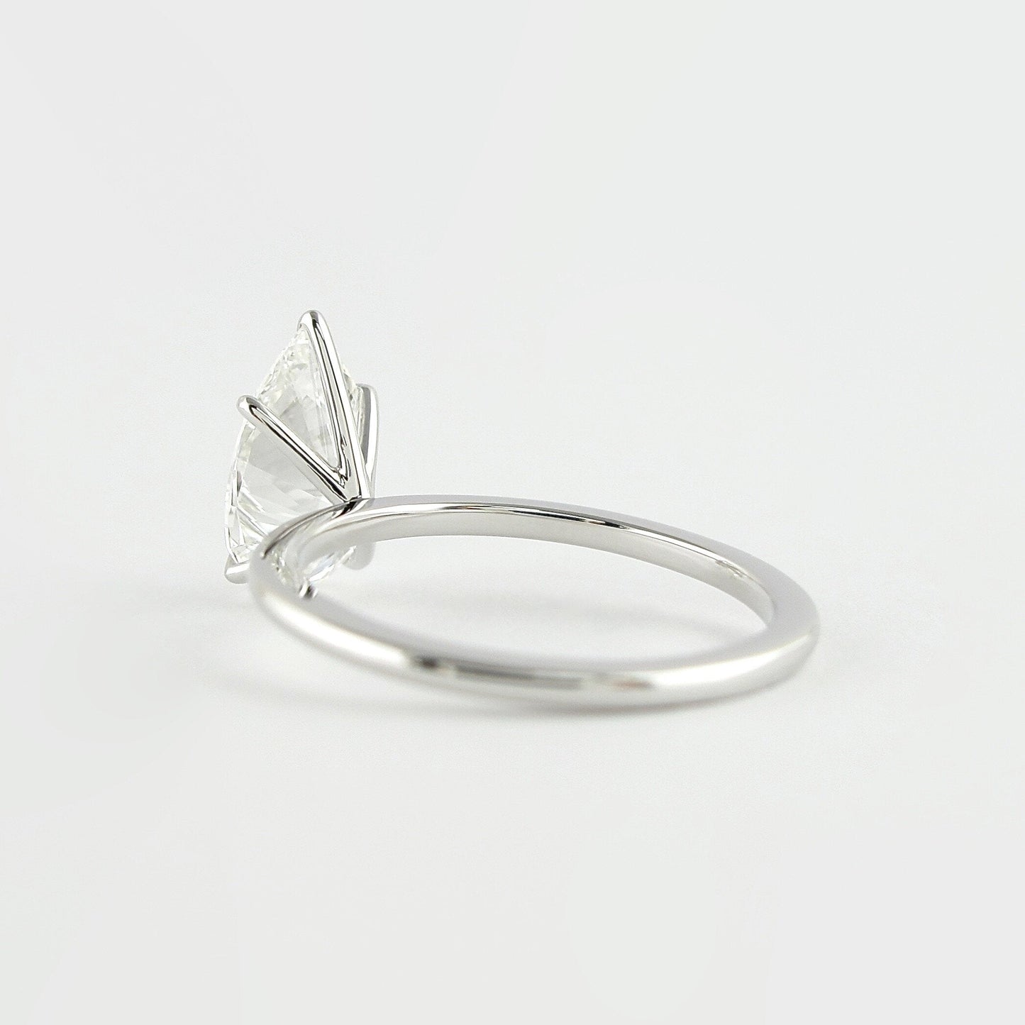 1.5 CT Pear Cut Solitaire Style Moissanite Engagement Ring