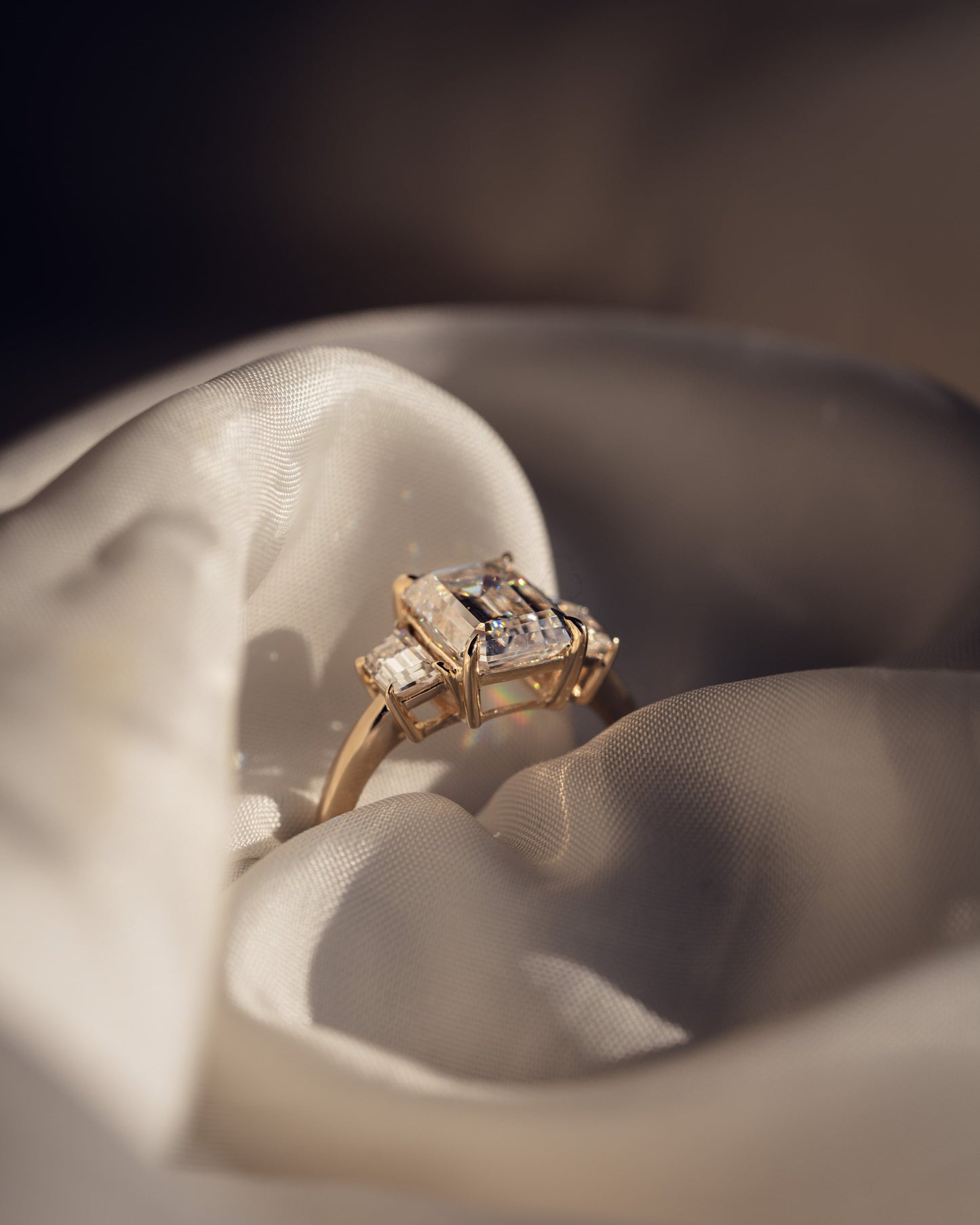 0.66 CT Emerald Cut Three Stone Moissanite Engagement Ring