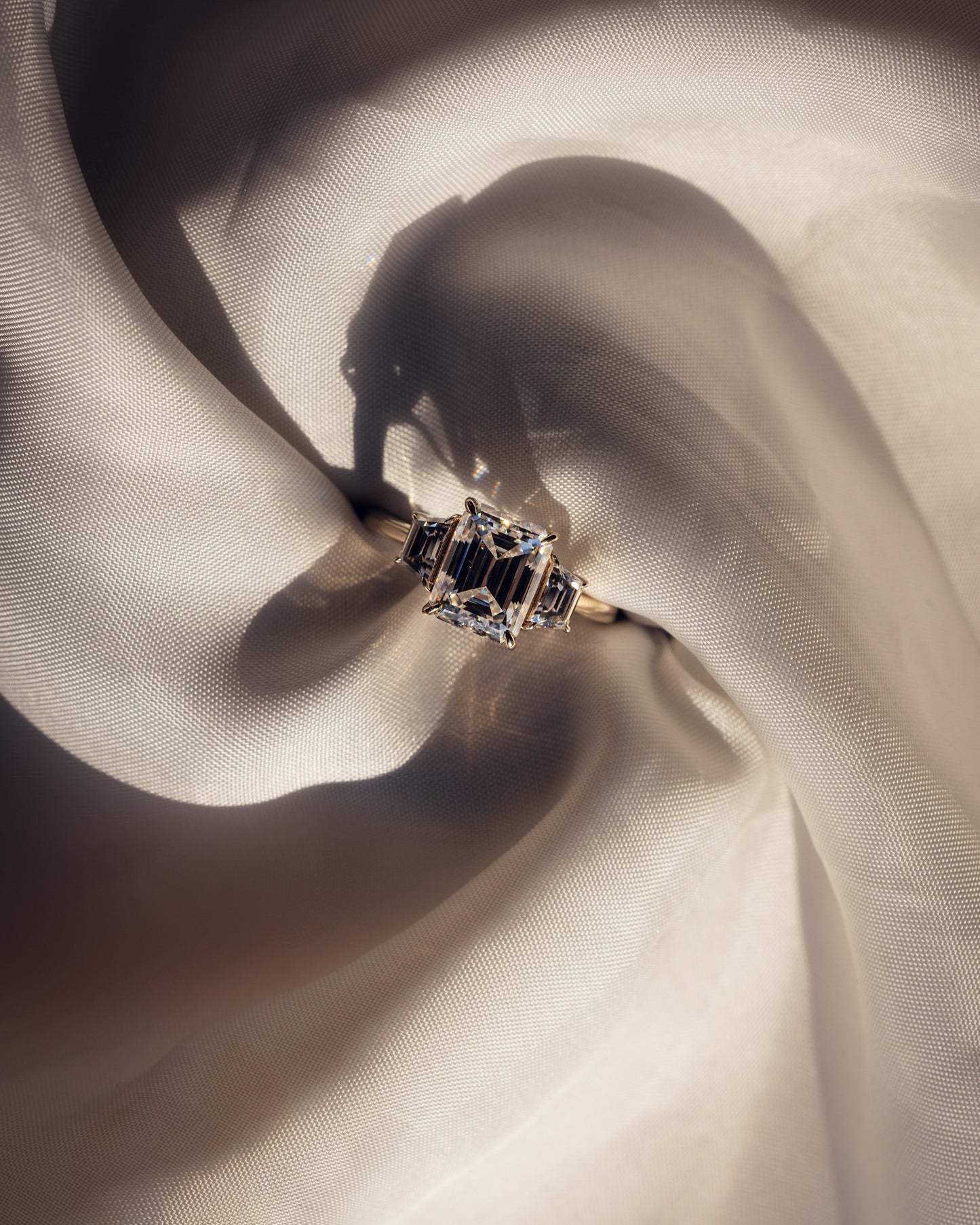0.66 CT Emerald Cut Three Stone Moissanite Engagement Ring