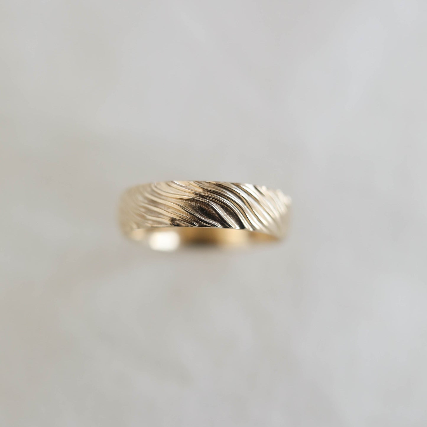 Yellow Gold Men's Wedding Band with wave like texture