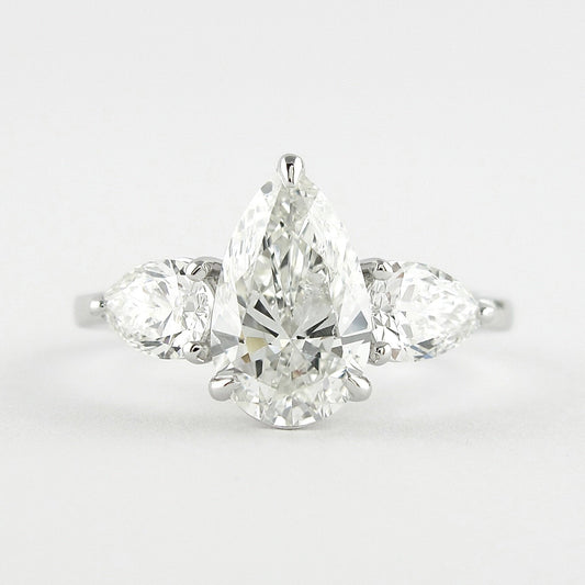 1.50 CT Pear Cut Three Stone Style Moissanite Engagement Ring