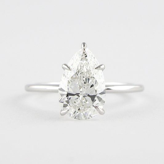 1.5 CT Pear Cut Solitaire Style Moissanite Engagement Ring