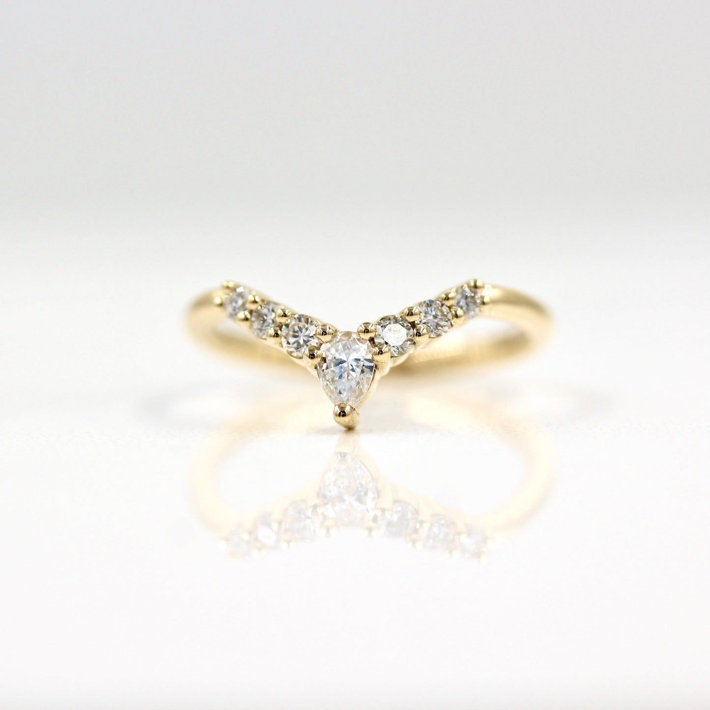 0.31 TCW Round & Pear Cut Curved Moissanite Wedding Band